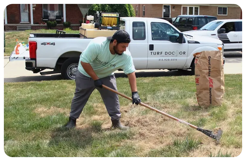 turf doctor tech working on lawn