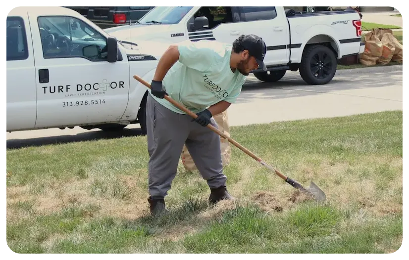 turf doctor tech working on lawn