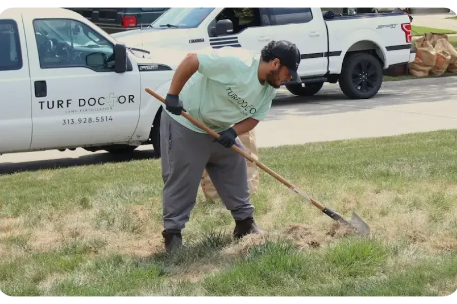 turf doctor tech working on lawn