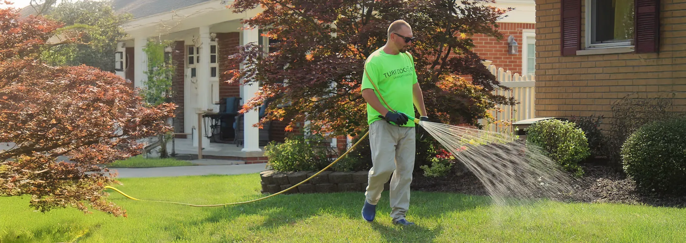 technician spraying lawn