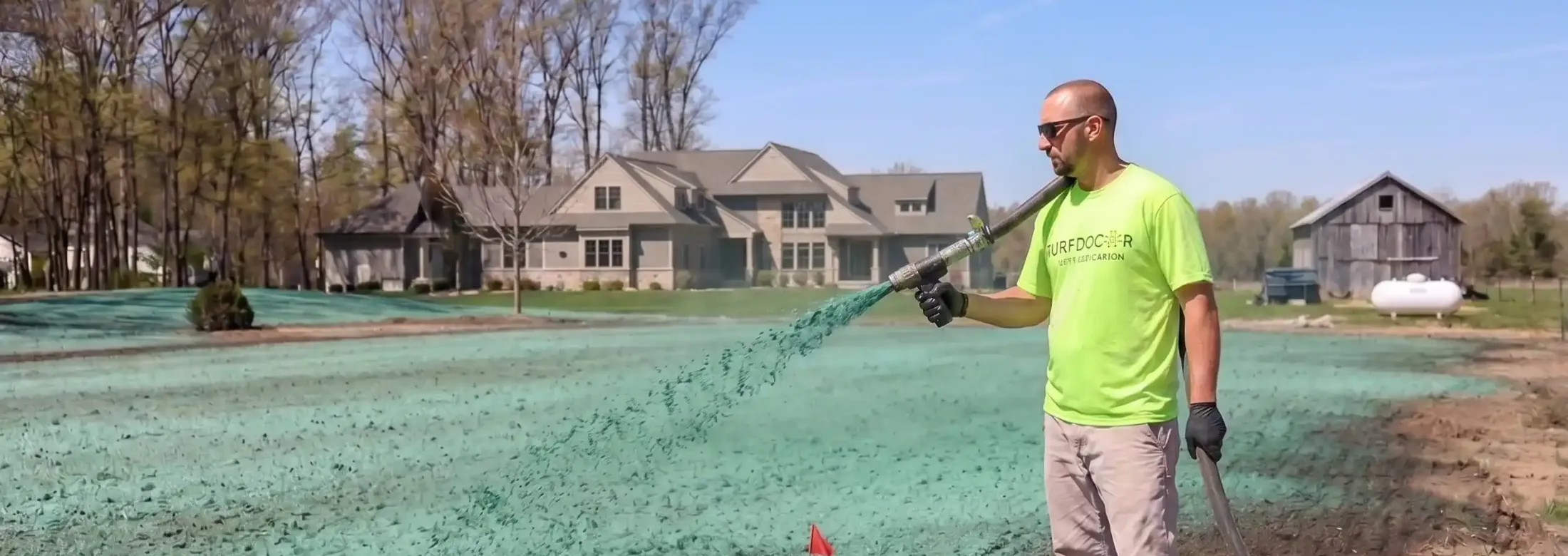 turf doctor lawn technician hydroseeding a lawn