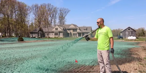 turf doctor lawn technician hydroseeding a lawn